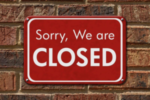 red "Sorry, We Are Closed" sign